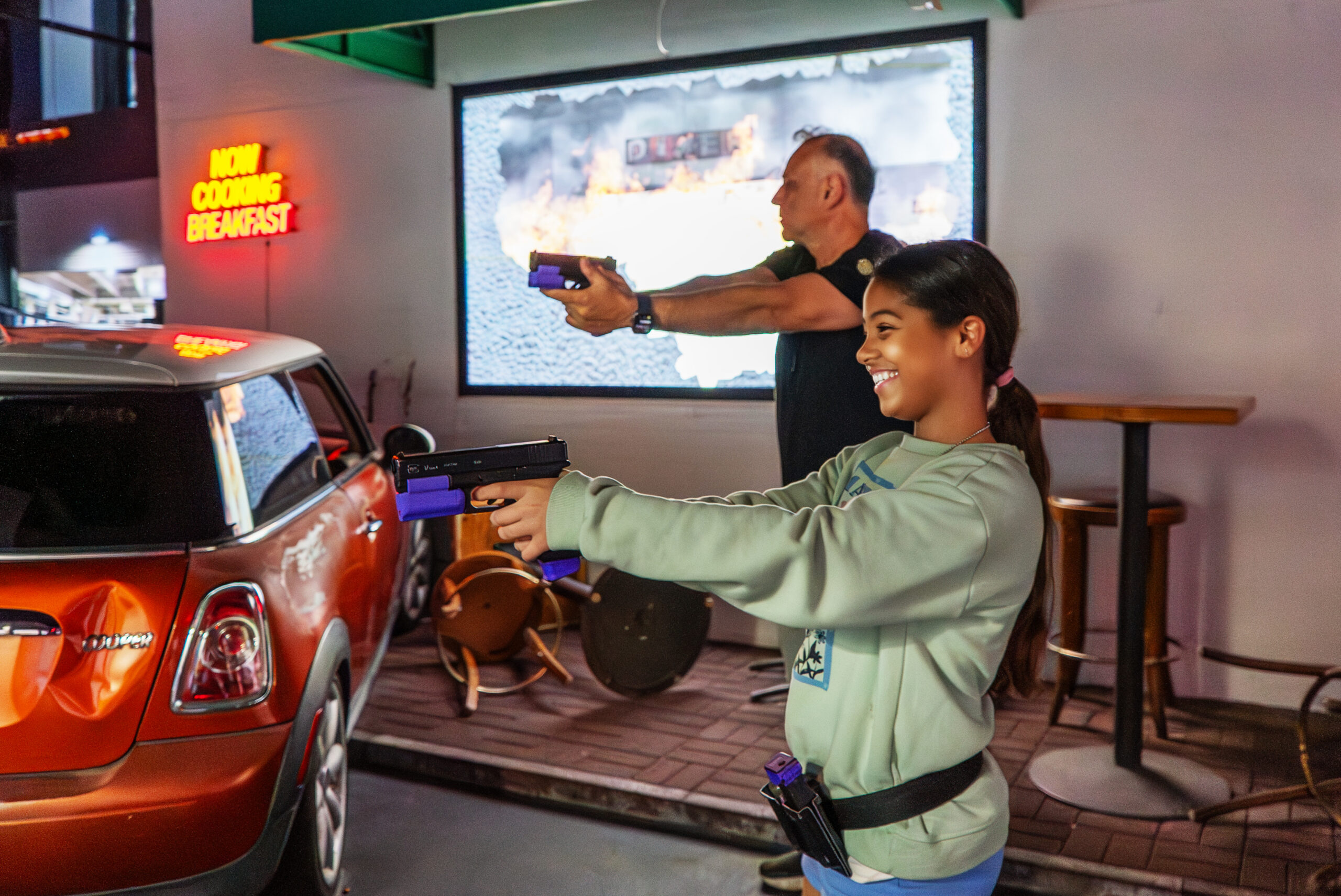 Social group of first-time guests enjoying a guided tactical experience at Decision Tactical — beginner-friendly indoor attraction in North Orlando, no experience required
