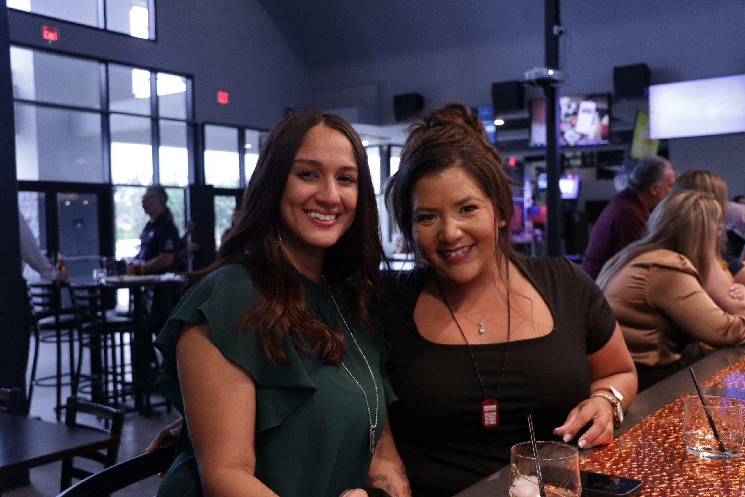 Members socializing at Decision Tactical's full-service bar and grill in North Orlando — individual membership perks include exclusive access and ongoing training